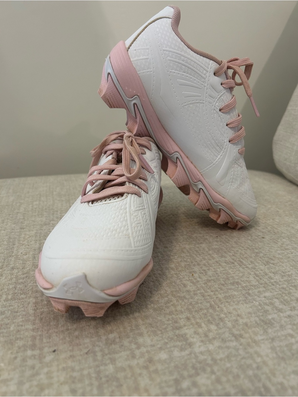 Under Armour White and Pink Kids Athletic Cleats